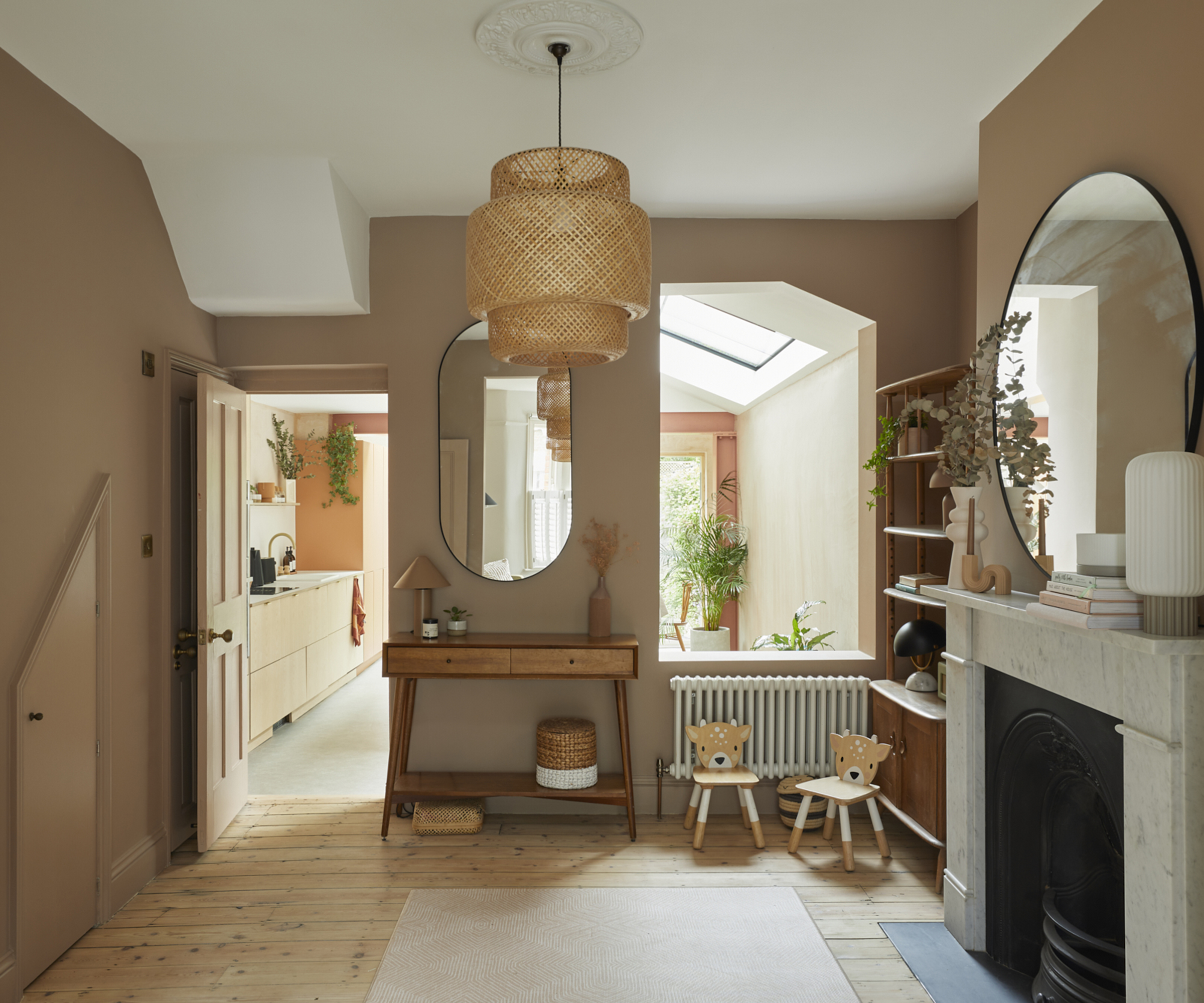 "semi-open plan" downstairs with a distinct living and kitchen area but also with a beautiful large "window"opening between the two rooms - which is used as a two way seating area for each space.