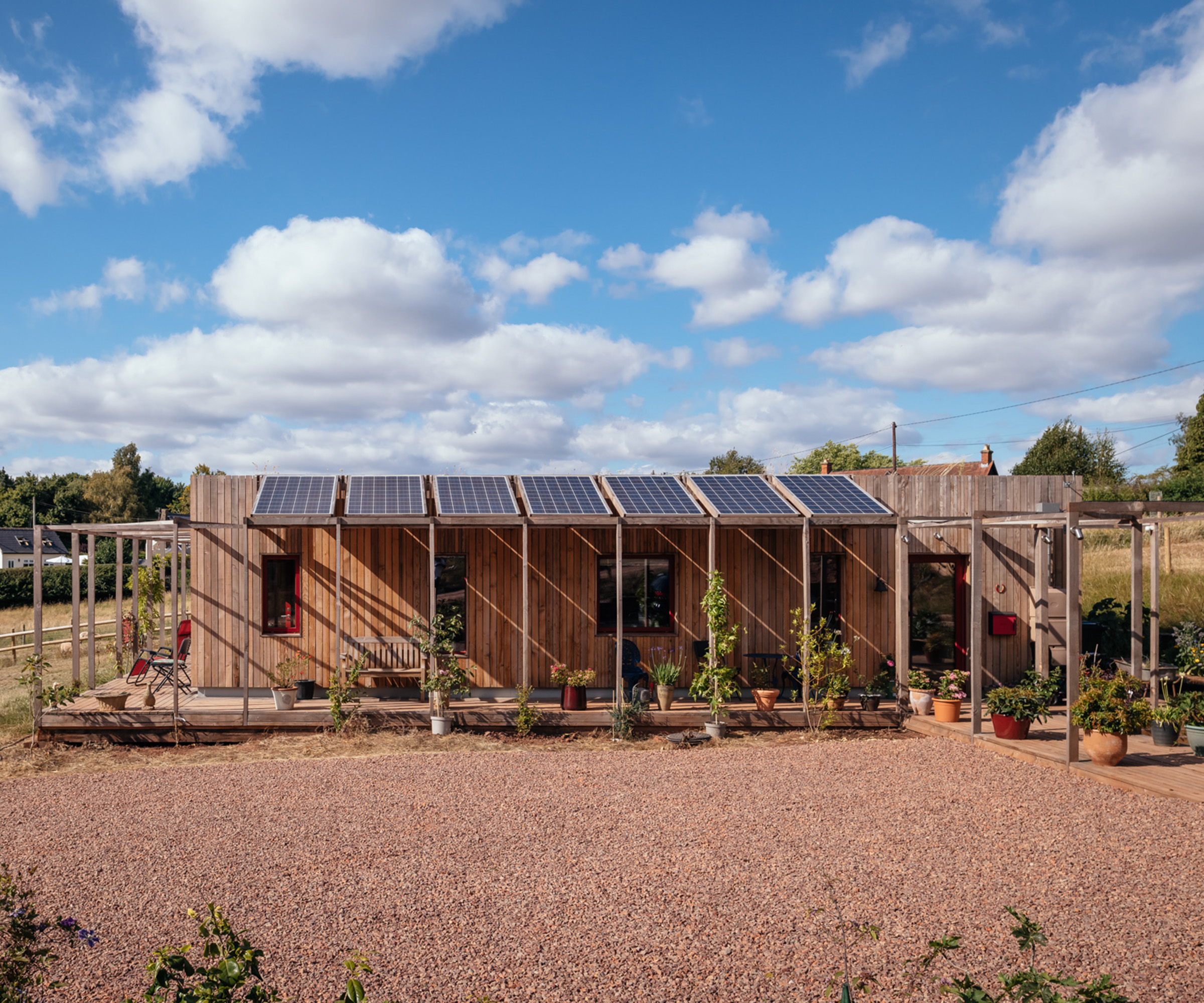 Front view of a self build house using reclaimed railway sleeper foundations, and the home itself sits on 100% recycled and recyclable jackpad foundations