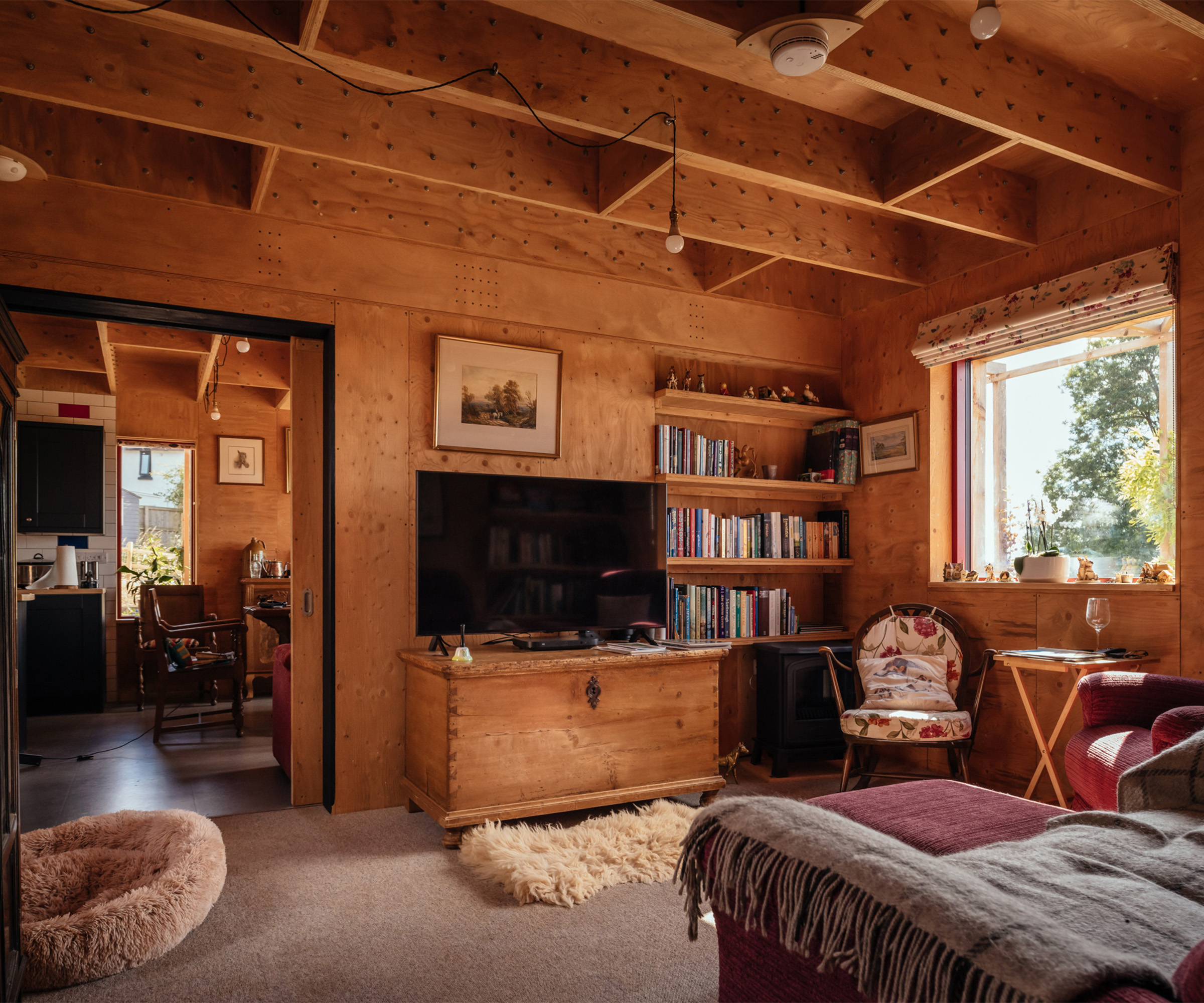 Cosy wooden interior of a self build concrete-free constructed using modular timber panels 